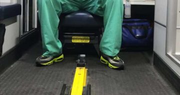 Dr. Geoffrey Mount Varner, ER physician and decision-making keynote speaker, in an ambulance